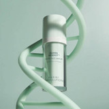 Jan Marini Reboot PDRN Face Serum beside a mint DNA helix sculpture