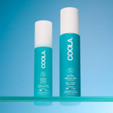 Two Coola SunBlur Primer bottles on a blue backdrop