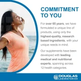 Smiling woman by the sea, Douglas Laboratories commitment to you graphic