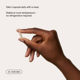 Hand holding Protein Optimizer capsule, one daily shelf-stable graphic