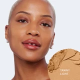 Model with glo Pressed Base swatch in Tawny Light
