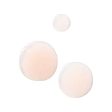 Drops of pale pink serum