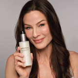 Smiling model holding epionce Gentle Foaming Cleanser bottle
