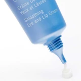 Tube tip dispensing a drop of eye and lip cream