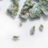 Broken pieces of green seaweed soap
