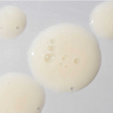 Close-up of creamy serum drops