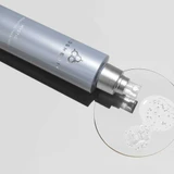 Mist bottle lying beside a dish of clear gel