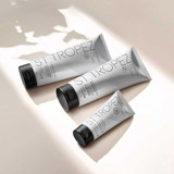Three St Tropez Gradual Tan tubes in soft sunlight