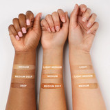 Swatches of each primer shade on three different skin tones