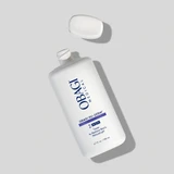 Obagi Nu-Derm Toner bottle with cap removed on gray background