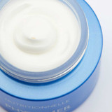 Close-up of rich white cream in the open Nutritionnelle jar