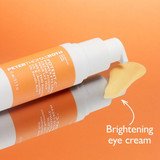 Potent-C bottles lying down with a brightening eye cream swatch
