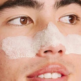 Man wearing white foaming mask across his nose