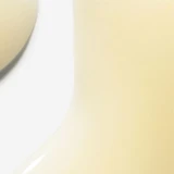 Close-up of pale yellow BioLumin-C serum texture