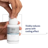 Hand opening Obagi CLENZIderm Pore Therapy bottle with pore benefit text