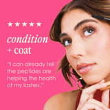 Woman with full lashes, GrandeMASCARA condition and coat review