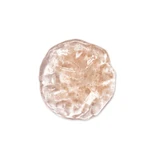 Round swatch of clear peach cleanser gel