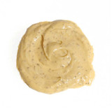 Swatch of speckled pumpkin enzyme mask