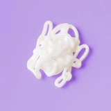 Swirl of white cream on purple