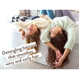 Two women lying back with curly hair and detangling text