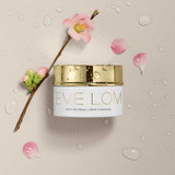 Eve Lom Moisture Cream jar with blossom branch and water droplets