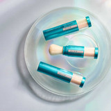 Three Brush-On Shield brushes in a glass dish