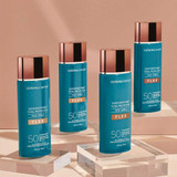 Four Colorescience Face Shield Flex SPF 50 bottles on acrylic blocks