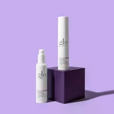 glo Phyto-Calm Aloe Hydrator and a glo pump bottle on a purple block