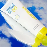 Clearing Defense SPF 30 tubes against a blue sky
