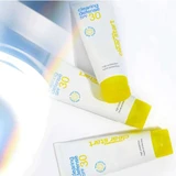 Three Clearing Defense SPF 30 tubes in the light
