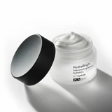 Open HydraBright jar with lid beside it showing white cream