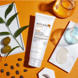 Replenix Hydrating Antioxidant Sunscreen tube with olives and cream swatch