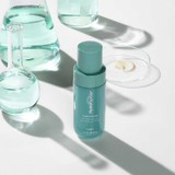 Clear Rescue serum bottle with lab glassware and a cream sample