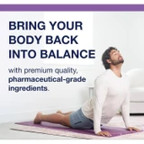 Man stretching on a yoga mat with balance message
