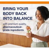 Woman tossing an orange with balance text