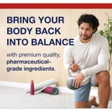Man kneeling on a yoga mat with body balance text