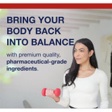 Woman lifting a small dumbbell beside balance message