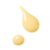 Swatch of pale yellow Revitalizing Day Lotion texture