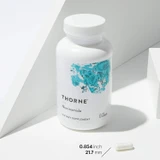 Thorne Niacinamide bottle with a capsule measuring 0.854 inches
