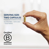 Hand holding a capsule, serving size two capsules with Certified B Corporation logo