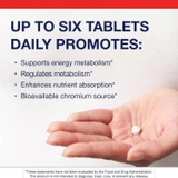Hand holding a Chromium Picolinate tablet, up to six tablets daily graphic