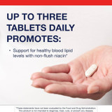 Hand holding a Lipotain tablet, up to three tablets daily with non-flush niacin graphic