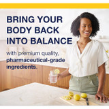 Woman pouring lemon water, bring your body back into balance