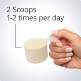 Hand holding a scoop of UltraMeal powder, 2 scoops 1-2 times per day