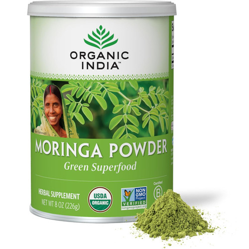 Organic India Moringa Powder Green Superfood 226 g canister with pile of powder