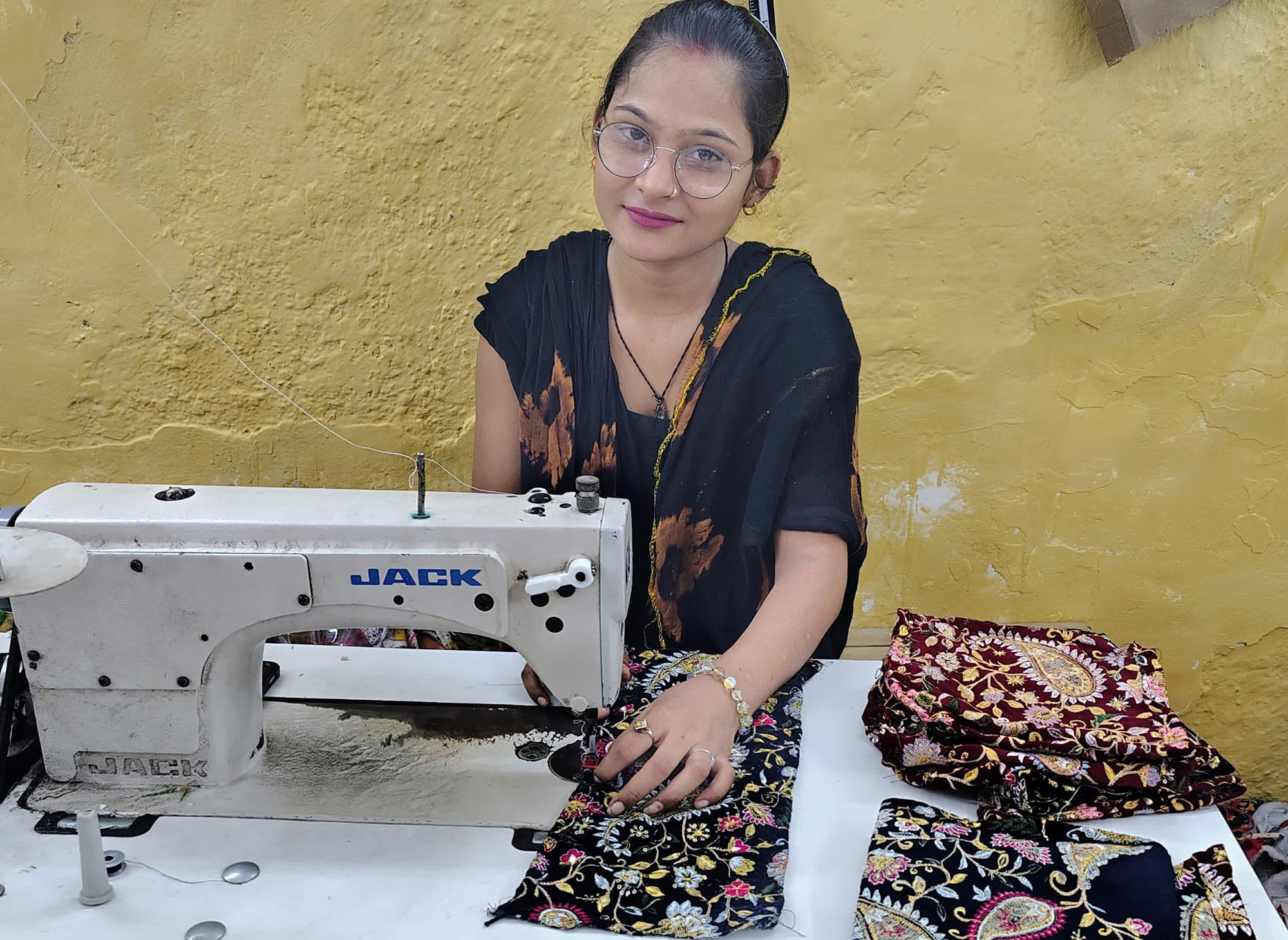 Our partner stitching the handmade pumpkins