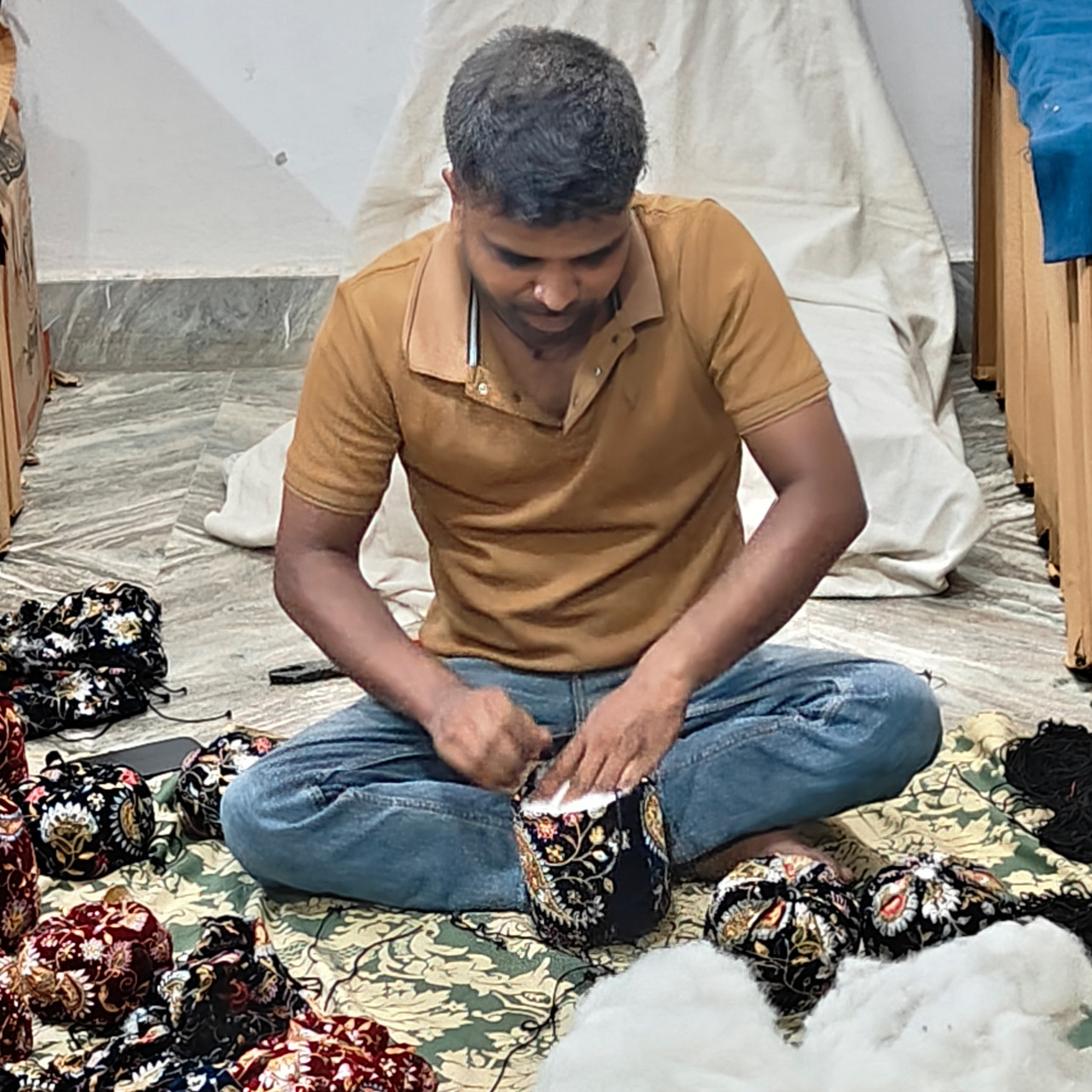 Our partner stuffing the handmade pumpkins