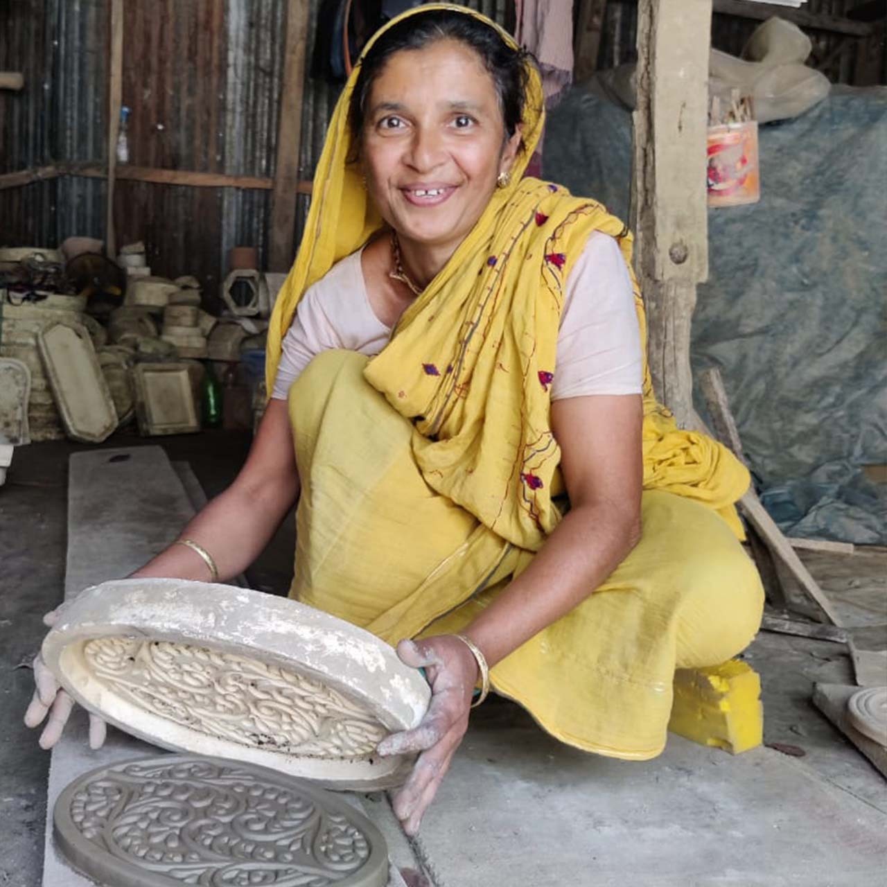 Artisan making a bread warming stone