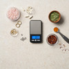 Compact pocket scale with stainless steel platform