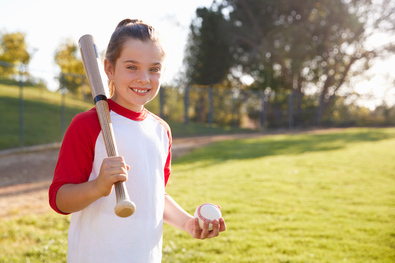 girl with baseball and bat